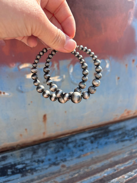Graduating Navajo pearl hoops