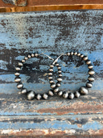 Graduating Navajo pearl hoops